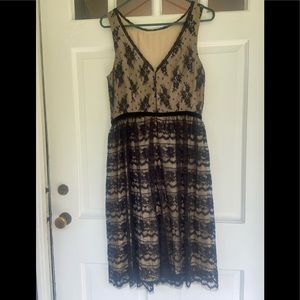 Beautiful Beige Fit and Slightly Flared Dress with Black Lace Overlay